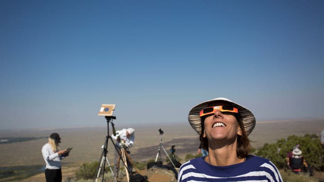 Locals and travelers from around the world gather on Menan Butte to watch the eclipse on August 21, 2017 in Menan, Idaho.