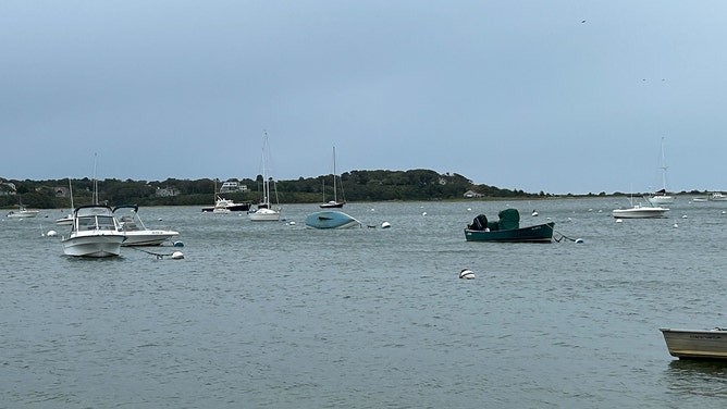 A boat flipped over in Chatham, Massasschuttes, on Saturday, as Lee made it's way north into Canada.