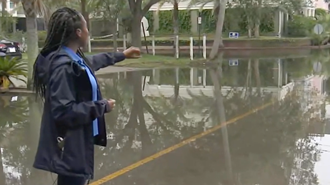 Campbell in flooded neighborhood street. Sept. 29, 2023.