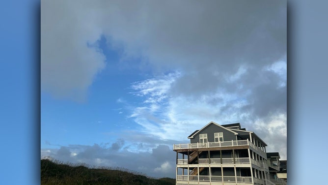A rainbow is seen in Hatteras, North Carolina, on Saturday morning.