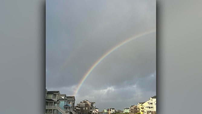 A rainbow is seen in Hatteras, North Carolina, on Saturday morning.