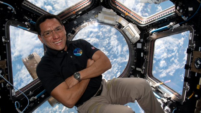 NASA astronaut Frank Rubio floats inside the cupola, the International Space Station’s