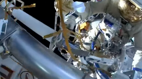 Russian cosmonauts examine leaky radiator outside space station during spacewalk