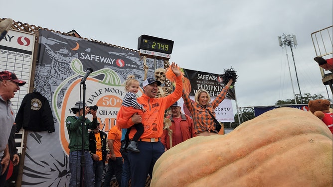 Travis Grienger set a potential world record for the heaviest pumpkin ever at the Safeway World Championship Pumpkin Weigh-Off in Half Moon Bay, California, on Monday, Oct. 9, 2023.