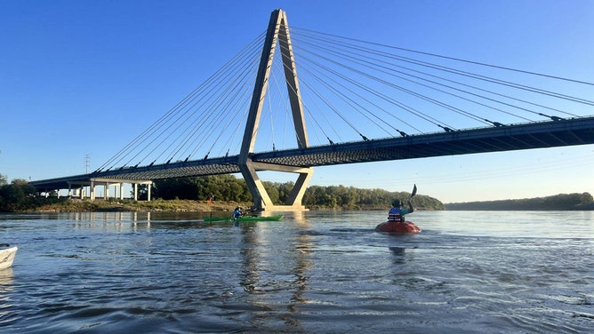 Steve Kueny, a competitive pumpkin farmer from Lebanon, Missouri, will break a Guinness World Record by paddling 39.17 miles in a 1,280-pound pumpkin named Huckle Berry.