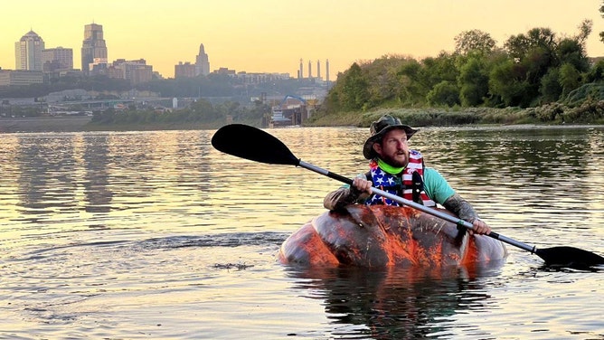 Steve Kueny, a competitive pumpkin farmer from Lebanon, Missouri, will break a Guinness World Record by paddling 39.17 miles in a 1,280-pound pumpkin named Huckle Berry.