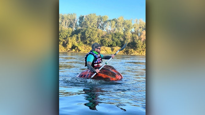 Steve Kueny, a competitive pumpkin farmer from Lebanon, Missouri, will break a Guinness World Record by paddling 39.17 miles in a 1,280-pound pumpkin named Huckle Berry.