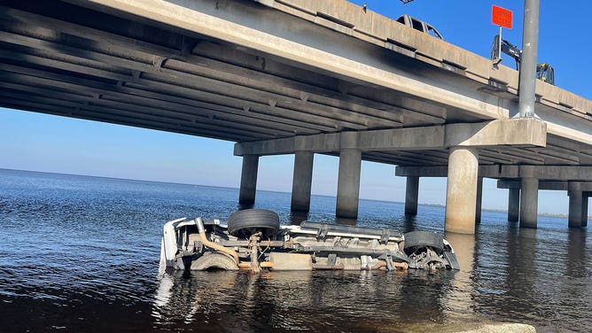 A car involved in the crash on I-55 in Louisiana is seen in the water Oct. 24, 2023.