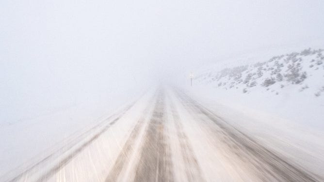 Whiteout road conditions.
