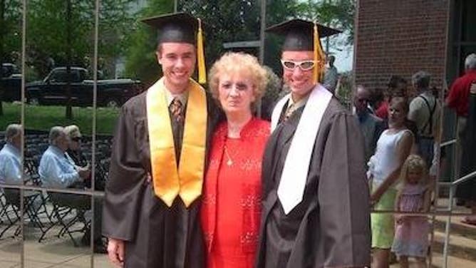 Brandon and Landon with their grandmother at the NC State graduation in 2005.