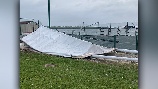 A look at the damage from the apparent tornado overnight as daylight arrives on Clearwater Beach, Florida, on Thursday.