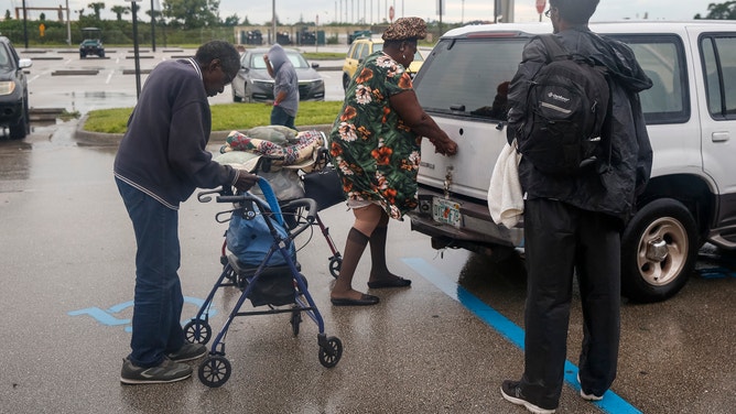 With the evacuation of St. Lucie County lifted, residents who have been staying in the shelter at Fort Pierce High School leave to return to their homes on September 4, 2019. - Hurricane Dorian churned towards the US Wednesday after leaving seven dead in the Bahamas. Dorian, which has dumped as much as 30 inches (76 centimeters) of rain on the Bahamas, was downgraded Tuesday morning to a Category 2 hurricane on the five-level wind scale. But it is "expected to remain a powerful hurricane during the next few days," the National Hussicane Center said. (Photo by Adam DelGiudice / AFP) (Photo credit should read ADAM DELGIUDICE/AFP via Getty Images)