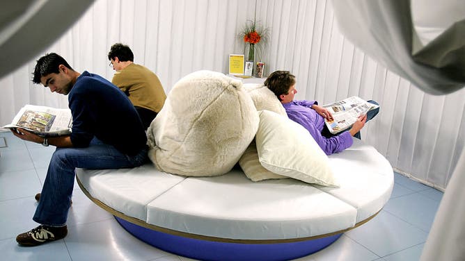 2006 File photo: Visitors sit in the Light Lounge, an ambient white space containing four specially designed light boxes where visitors can relax and have light therapy, in the Science Museum's Dana Centre in London, 10 January 2006. Light therapy is used to help combat SAD (Seasonal Affective Disorder) which affects 1 in 50 people during the darker months of the year.