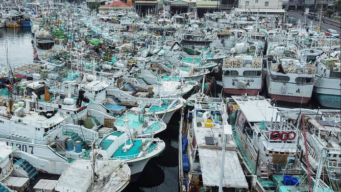 Fishing boats are moored at Tunggang fishing harbour ahead of the arrival of Typhoon Koinu in Pingtung county on October 4, 2023.