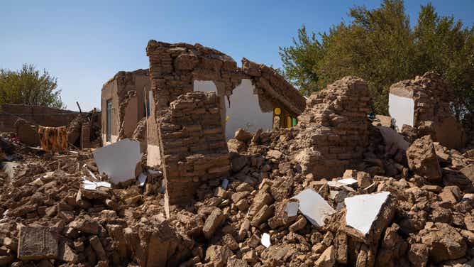 10/08/2023 Herat, Afghanistan. Ruins and rubble from demolished houses are seen in the city of Herat after a massive 6.3 magnitude earthquake, resulting in thousands of injuries and fatalities. Afghan mourners are seen covering a grave with soil following the funeral prayers for the victims of the earthquakes in Kashkak village, Zendeh Jan district of Herat province on October 8, 2023. The death toll from a series of earthquakes in western Afghanistan drastically increased on October 8, with the number surpassing 2,000, and nearly 10,000 people reported as injured. Rescue workers tirelessly searched through destroyed villages, hoping to find any signs of life. According to officials, more than 1,300 homes were demolished when a magnitude 6.3 earthquake, followed by eight strong aftershocks, struck remote areas located 30 kilometers (19 miles) northwest of the provincial capital of Herat. (Photo by Muhammad Balabuluki / Middle East Images / Middle East Images via AFP) (Photo by MUHAMMAD BALABULUKI/Middle East Images/AFP via Getty Images)