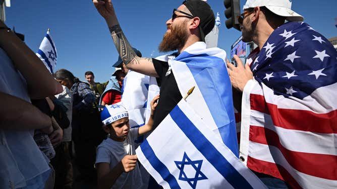 Demonstrators gather during a rally in support of Israel, outside the West Los Angeles Federal Building in Los Angeles, California, on October 10, 2023. Israel said it recaptured Gaza border areas from Hamas on October 10, 2023, the fourth day of fierce fighting that has left thousands dead on both sides since the militants launched a surprise attack. (Photo by Robyn Beck / AFP) (Photo by ROBYN BECK/AFP via Getty Images)