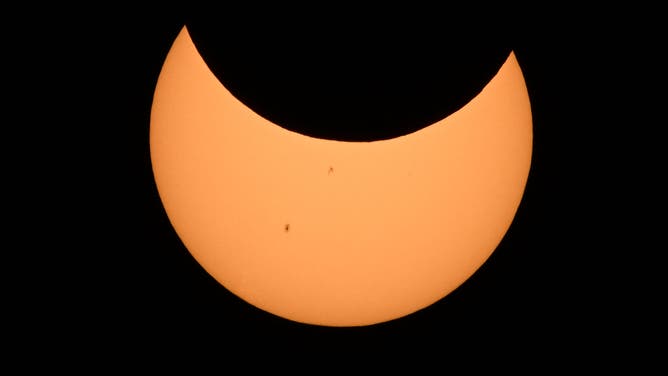 The Moon crosses in front of the Sun over Albuquerque, New Mexico, during an annular eclipse on October 14, 2023. (Photo by Patrick T. Fallon / AFP) (Photo by PATRICK T. FALLON/AFP via Getty Images)