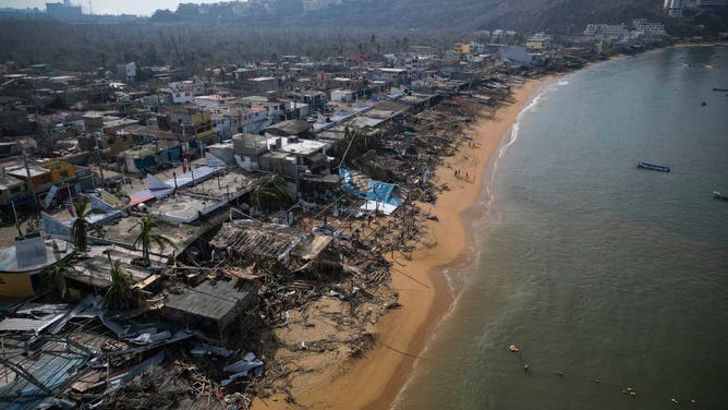 TOPSHOT - Aerial view of damages caused by the passage of Hurricane Otis in Puerto Marques, Guerrero State, Mexico, on October 28, 2023. The death toll from an extraordinarily powerful hurricane that blasted the Mexican resort city of Acapulco rose Saturday to 39, the Mexican government said. (Photo by Rodrigo OROPEZA / AFP) (Photo by RODRIGO OROPEZA/AFP via Getty Images)