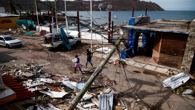 TOPSHOT - View of damages caused by the passage of Hurricane Otis in Puerto Marques, Guerrero State, Mexico, on October 28, 2023. The death toll from an extraordinarily powerful hurricane that blasted the Mexican resort city of Acapulco rose Saturday to 39, the Mexican government said. (Photo by Rodrigo OROPEZA / AFP) (Photo by RODRIGO OROPEZA/AFP via Getty Images)