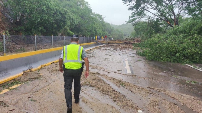 Roadways blocked trying to reach hard-hit coastal town in Mexico from Hurricane Otis.