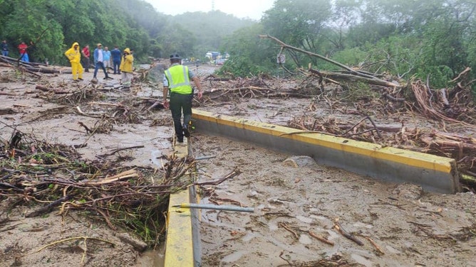 Roadways blocked trying to reach hard-hit coastal town in Mexico from Hurricane Otis.