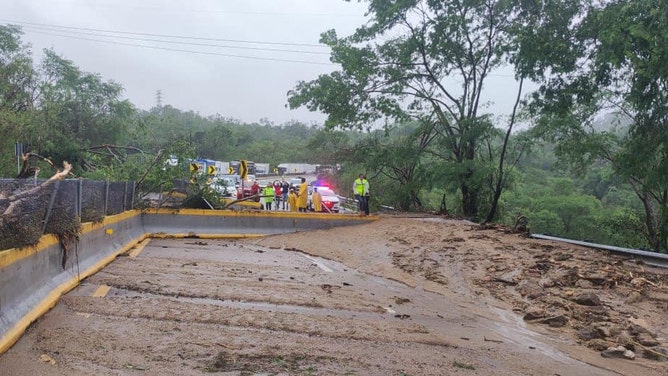 Roadways blocked trying to reach hard-hit coastal town in Mexico from Hurricane Otis.