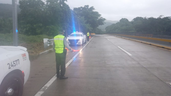 Roadways blocked trying to reach hard-hit coastal town in Mexico from Hurricane Otis.