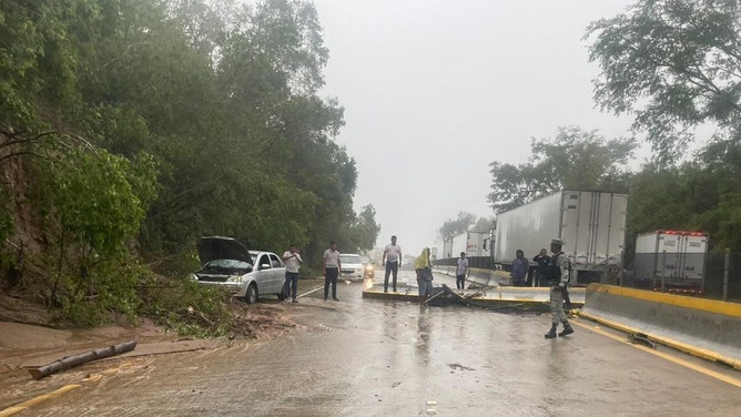 Roadways blocked trying to reach hard-hit coastal town in Mexico from Hurricane Otis.