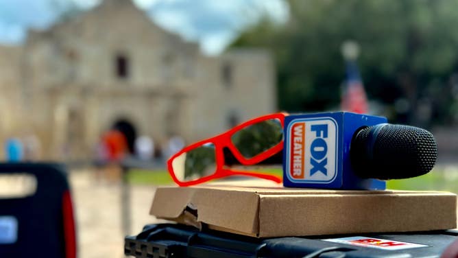 FOX Weather's Robert Ray sets up to capture the annular solar eclipse on Oct. 14, 2023 in San Antonio, Texas at the Alamo.