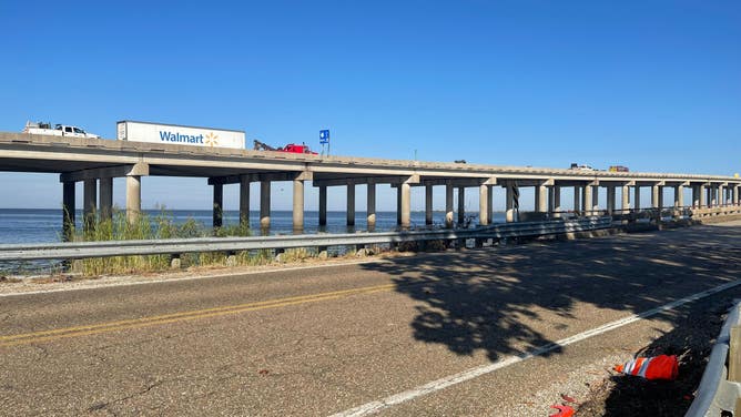 Work to remove mangled vehicles from Interstate 55 outside of New Orleans continues.
