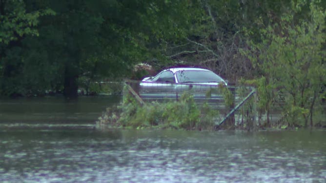 Floodwater surrounds a vehicle in Kaufman County, Texas, on Oct. 28, 2023.