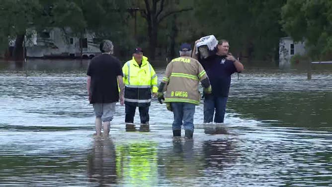 Rescue crews assist residents who had to be evacuated from their homes because of flooding in Kaufman County, Texas, on Oct. 28, 2023.