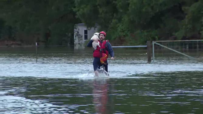 Rescue crews assist residents who had to be evacuated from their homes because of flooding in Kaufman County, Texas, on Oct. 28, 2023.