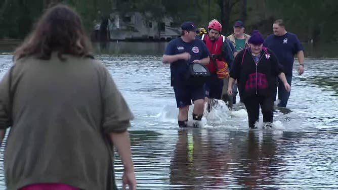 Rescue crews assist residents who had to be evacuated from their homes because of flooding in Kaufman County, Texas, on Oct. 28, 2023.