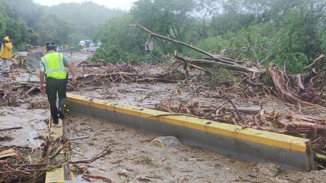 Roadways blocked trying to reach hard-hit coastal town in Mexico from Hurricane Otis.