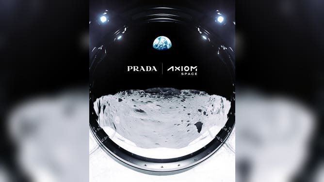 Logos of Axiom Space and Prada reflected on a space helmet above the lunar surface. 