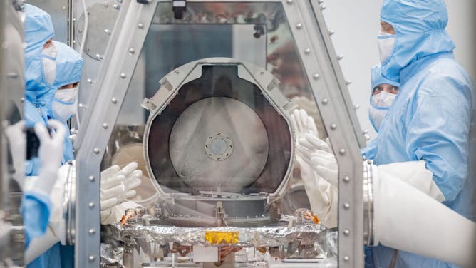 OSIRIS REx Asteroid Sample Return lid opening at Building 31 Astromaterials Curation Facility. Photo Date: September 26, 2023. Location: Bldg. 31 - OSIRIS REx Thin Section Lab. Photographer: Robert Markowitz