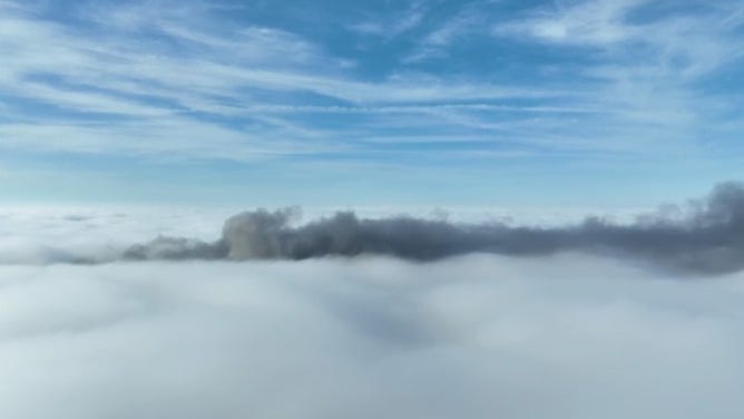 Drone footage near the scene of a massive pileup in Louisiana on October 23 takes us above the fog and we can see the smoke from the burning vehicles mixing in.