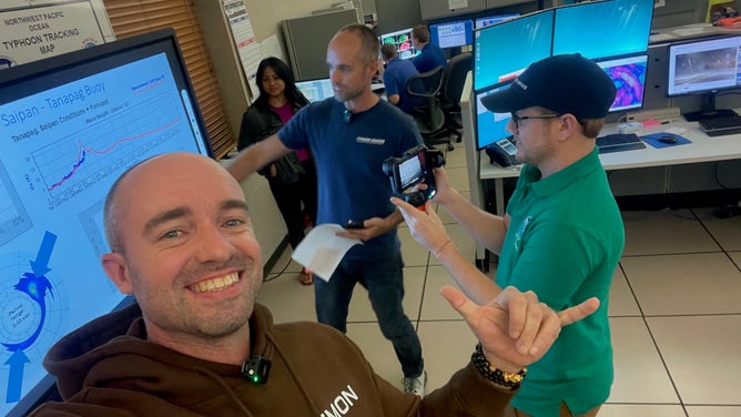 Landon, Brandon and team communicate weather information while at NWS Guam.