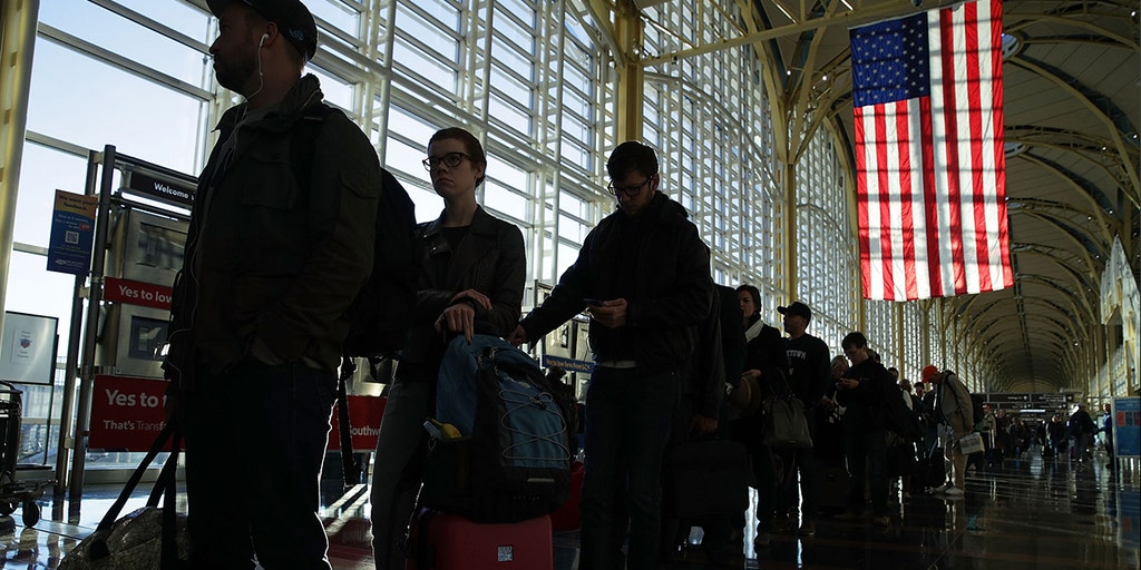 The storm stretches across the country for more than 1,500 miles with travel problems continuing into Thanksgiving