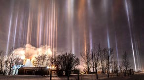 Light pillars illuminate night sky over Canada