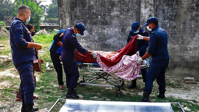 Medical personnel attend to a wounded victim at a hospital in Nepalgunj after an earthquake in western Nepal on November 4, 2023.
