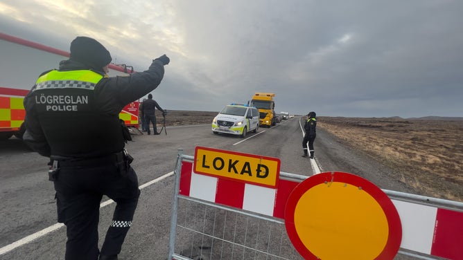 GRINDAVIK, ICELAND - NOVEMBER 14: Police direct traffic out of Grindavik on November 14, 2023 in Grindavik, Iceland. For the second day residents were allowed in to quickly collect personal belongings. (Photo by Micah Garen/Getty Images)