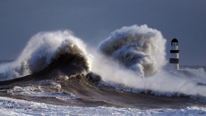 Spectacular waves crash into England shore as spring tides mix with ...