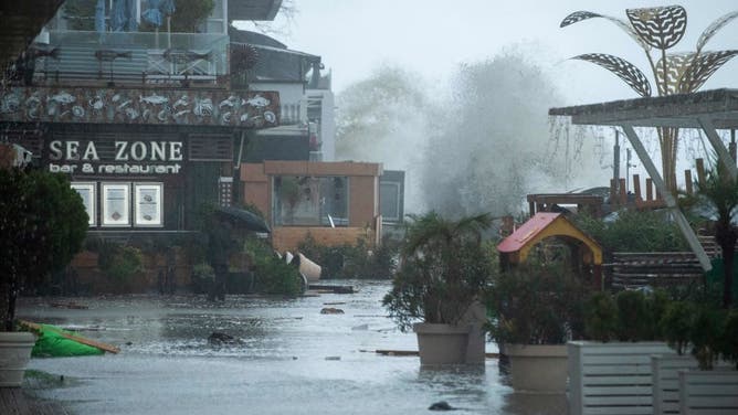 Waves crash against a seafront in the Black Sea resort city of Sochi during a storm on November 27, 2023.