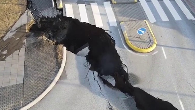 A large crack is seen in the middle of a road in Grindavik, Iceland, amid fears that a volcano there could erupt at any time.