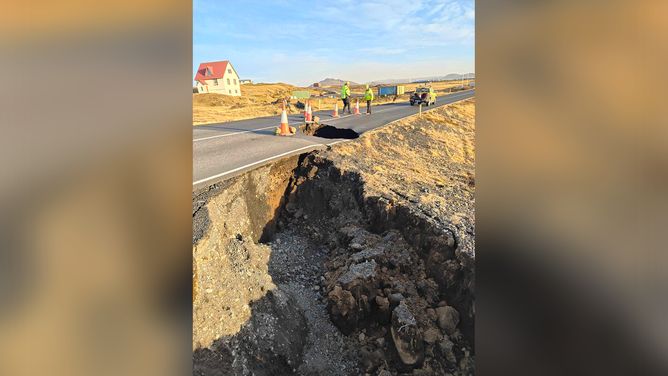 Crews are seen inspecting a road outside of Grindavik in Iceland amid fears of a volcanic eruption.