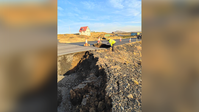 Crews are seen inspecting a road outside of Grindavik in Iceland amid fears of a volcanic eruption.