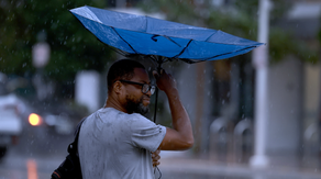 Florida braces for tropical downpours in wake of record-breaking heat