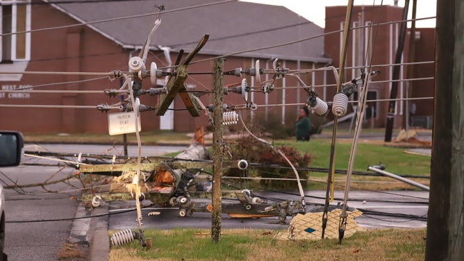 A destroyed utility pole is seen on the ground after severe weather in Tennessee on Saturday, Dec. 9, 2023.